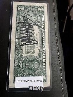Donal Trump double autographed dollar bill front and back $900 book value