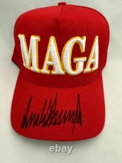 Donald Trump Autographed Hand Signed MAGA Hat (Red) Beckett LOA