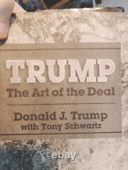 Trump The Art Of The Deal with a signed index card