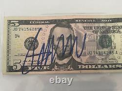 Donald Trump a signé un billet de 5 dollars authentique avec un autographe Beckett Encapsulation