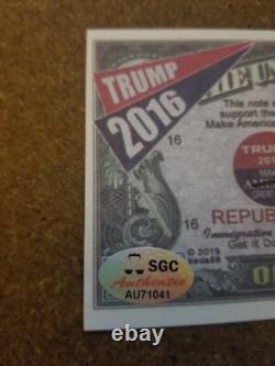 Le président DONALD TRUMP a signé le projet de loi sur l'argent Trump de 2016 MAGA SGC coa/hologramme MINT
